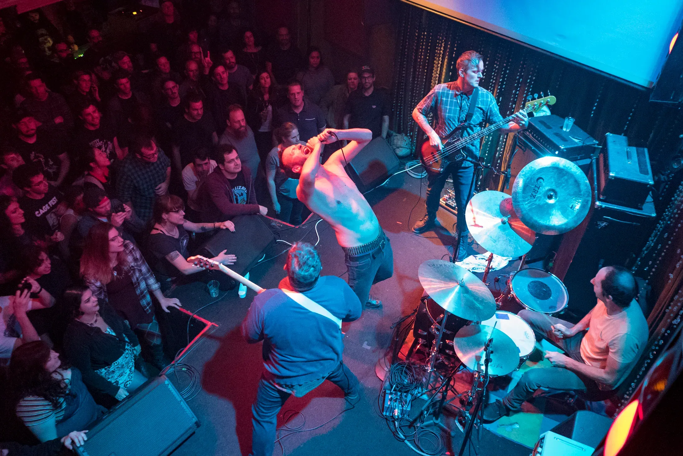 A live band performing to a packed room.