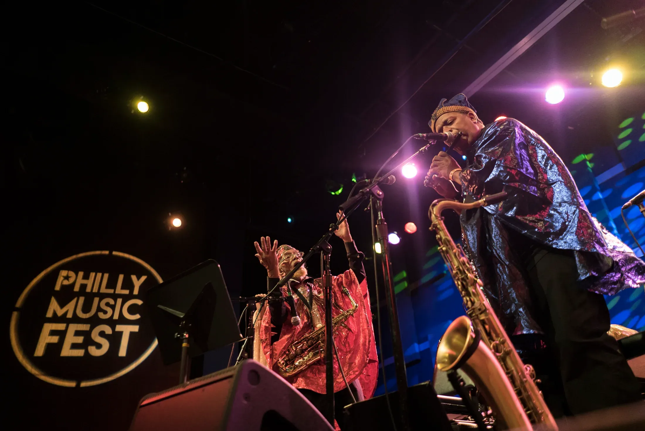 A horn section performing onstage at Philly Music Fest.