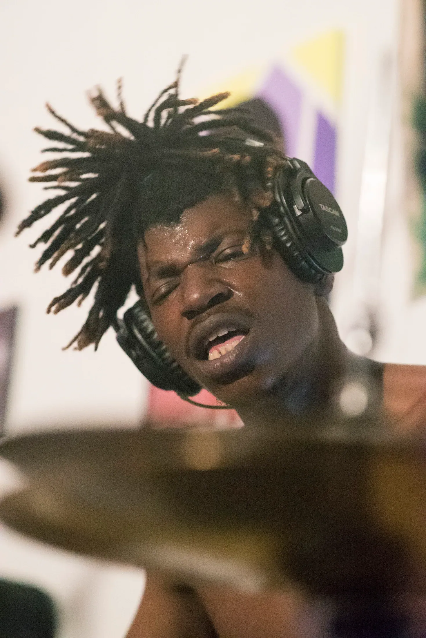 A close portrait of a performer in motion.