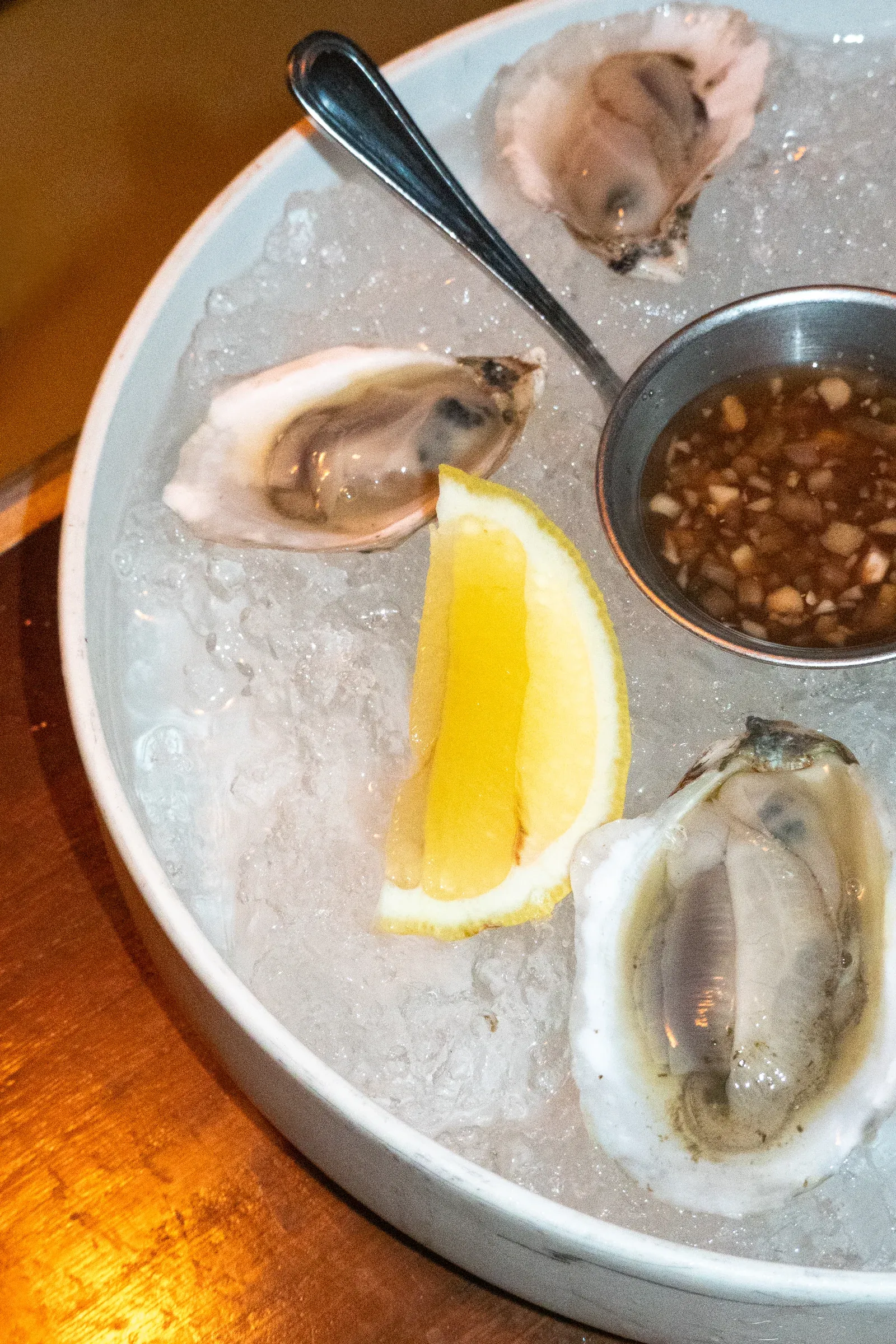 Oysters on ice with lemon and shallot mignonette at Tria.