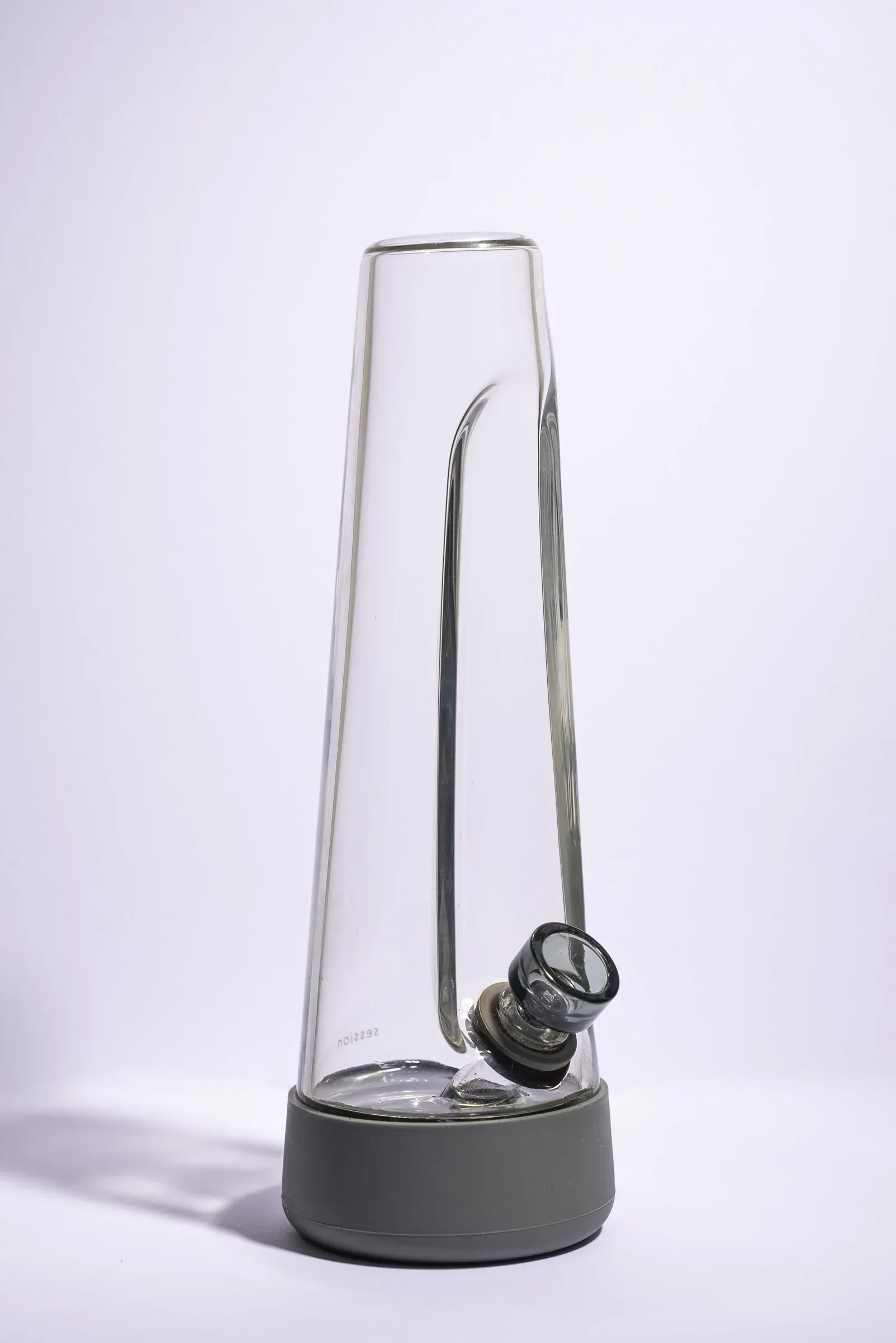 Clear glass smoking piece photographed on white.