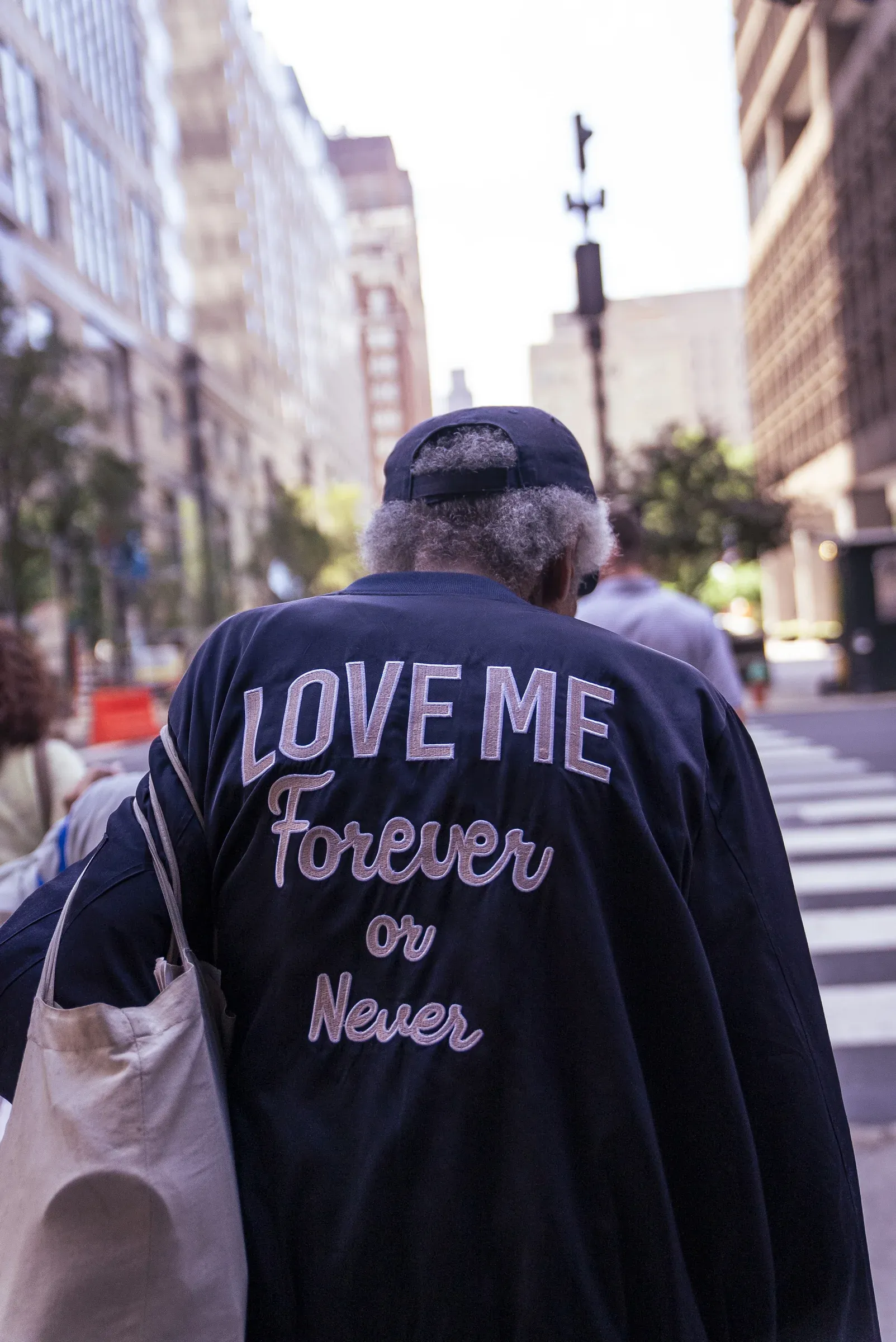 Handwritten words reading love me forever or never.